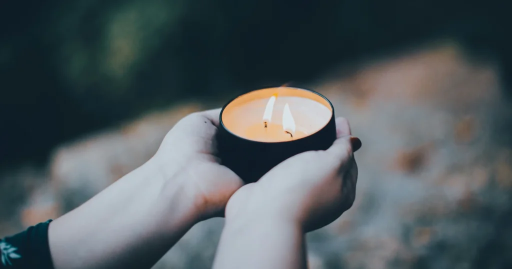 a person holding a candle